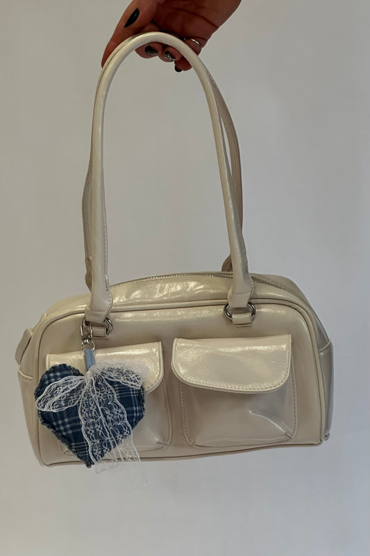 Cartera Cream + charm